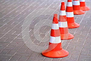 Traffic cones, protective signal plastic orange chips. Road works are carried out in a safe environment