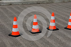 Traffic cones on the street secure the work