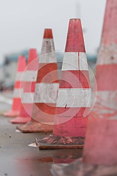 Traffic cones on the wet road. Caution ,danger, warning signs