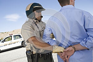 Traffic Cop Arresting Man photo