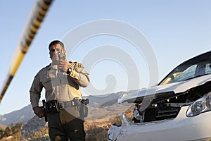 Traffic Cop Communicating On Walkie Talkie photo