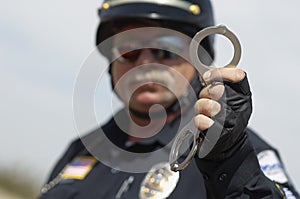 Traffic Cop Holding Handcuffs