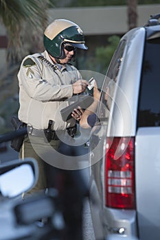 Traffic Cop Receiving Credit Card From Driver