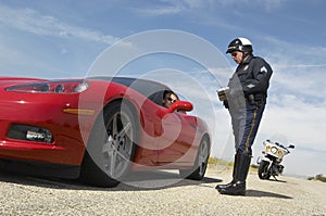 Traffic Cop Talking With Driver Of Sports Car