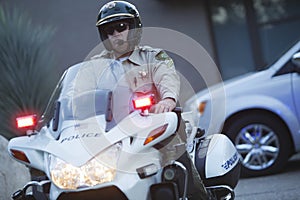Traffic Cop Wearing Helmet While Riding Motorbike