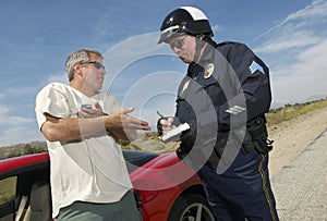 Traffic Cop Writing A Ticket