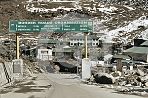 Traffic directional sign board on highway in the entrance of the city near India China border near Nathu La mountain pass in the