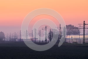 Traffic on electrified railroad track photo