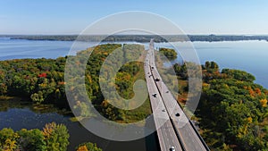 Traffic flowing smoothly on Canadian motorway, fall season colors