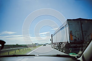 traffic on the freeway with cars and trucks overtaking