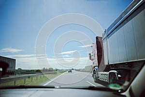 traffic on the freeway with cars and trucks overtaking