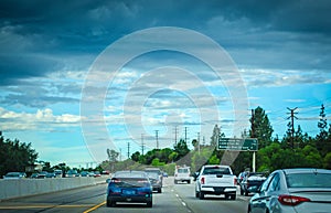 Traffic in a freeway on a cloudy day in California