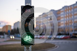 Traffic green light letting bicycle to pass in city