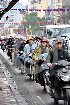 Traffic in Hanoi. Crowd of motorbike drivers on the street