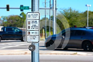 Traffic intersection pedestrian crosswalk crossing sign with signal descriptions