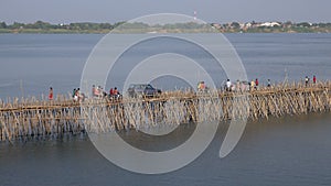 Traffic jam on the bamboo bridge over the Mekong River  time lapse