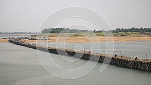 Traffic jam on the bamboo bridge over the Mekong River  time lapse