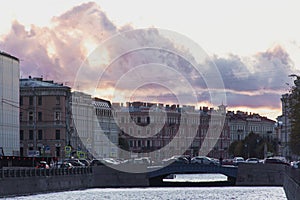 Traffic jam on beautiful small bridge with a sunset. Historical centre of Saint-Petersburg.