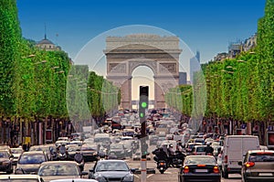 Traffic jam with cars in Paris city, France. view of Arc de Trio