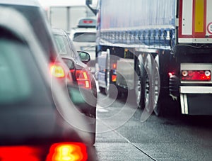 Traffic jam cars and trucks driving on road highway