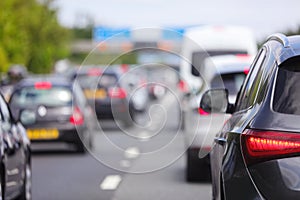 Traffic jam congestion with rows of cars on highway or motorway in rush hour