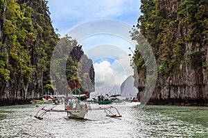 Traffic jam with lot of tourist boats in big lagoon. El Nido, Palawan