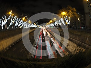 Traffic jam in madrid castilla place at night with car lights tracks