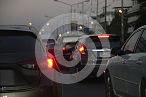 Traffic jam on night road, car driving in rush hour of city