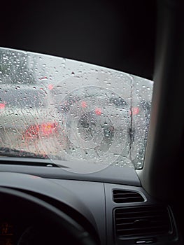 Traffic jam in rainy day through the car window, Vertical view