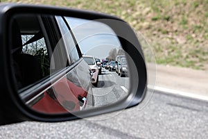 Traffic jam through rear-view mirror