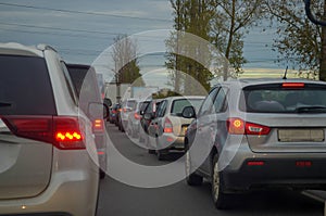 Traffic jam with row of cars on highway during rush hour.