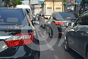 Traffic jam with row of cars during rush hour in a city street r