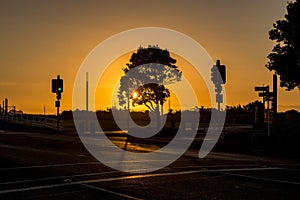 Traffic junction at Egmont St leading to Coastal Walkway car park during summer sunset.