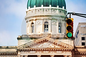 Traffic light against dome of Indiana Statehouse photo