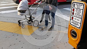 Traffic light button on pedestrian crosswalk, people have to push and wait. Traffic rules and regulations for public safety in USA