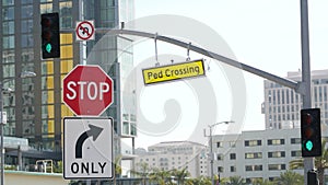 Traffic light and caution sign, road intersection in USA. Transportation safety, rules and regulations symbol. Driveway