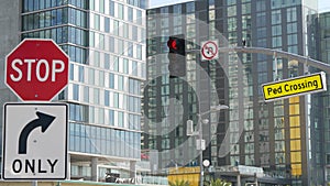 Traffic light and caution sign, road intersection in USA. Transportation safety, rules and regulations symbol. Driveway crossing