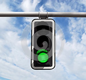 Traffic light - green against sky