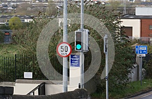 Traffic light with green light and speed limit sign. speed limit sign 50 km h. Ireland, Dublin.