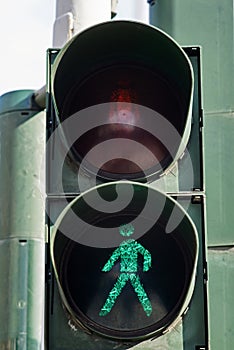 Traffic light with the green man sympol. photo
