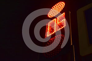 Traffic light at the intersection at night for pedestrians and cars