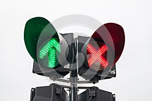 Traffic light with red cross and green arrow turned on.