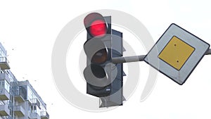 Traffic light on the road regulates traffic