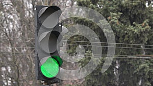 Traffic light on the road regulates traffic