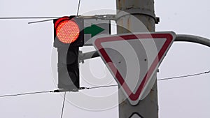 Traffic light on the road regulates traffic