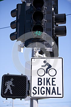 Traffic light and road sign for cyclists and pedestrians