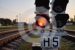 Traffic light show red signal on a railway, close up