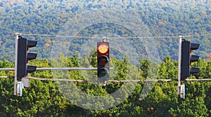 Traffic light showing red, stop sign