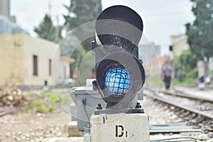 Traffic light shows red signal on railway.