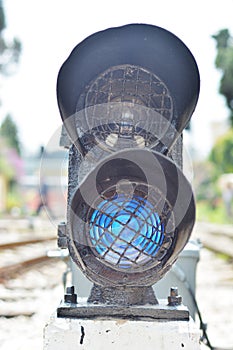 Traffic light shows red signal on railway.